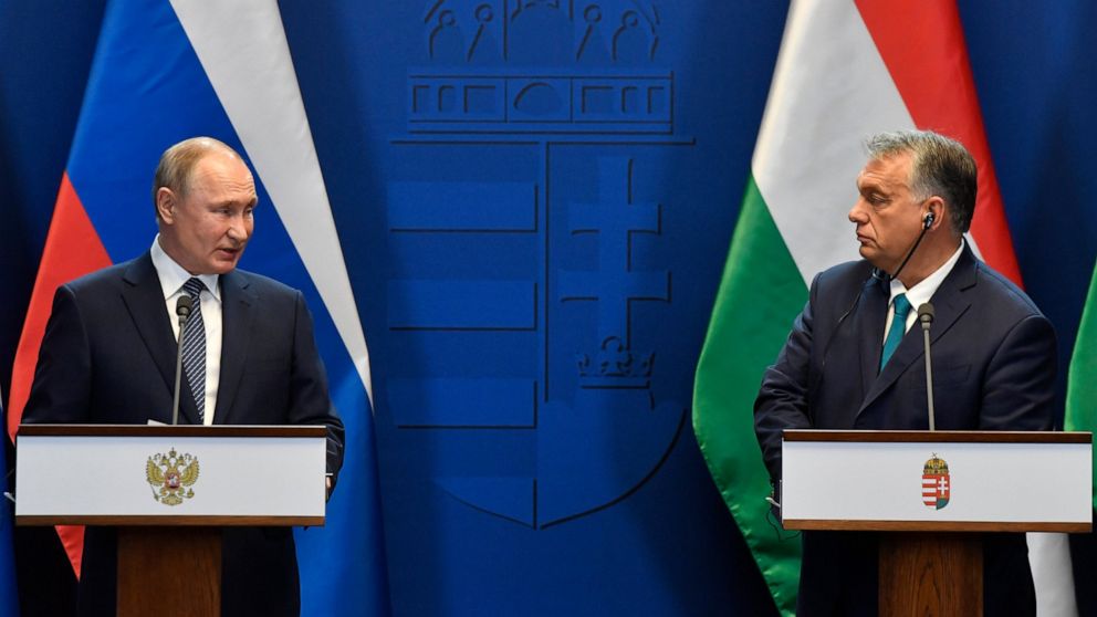 FILE - Hungarian Prime Minister Viktor Orban, right, and Russian President Vladimir Putin hold a joint press conference following their talks at the PM's office in the Castle of Buda in Budapest, Hungary, Wednesday, Oct. 30, 2019. Hungarian Prime Min