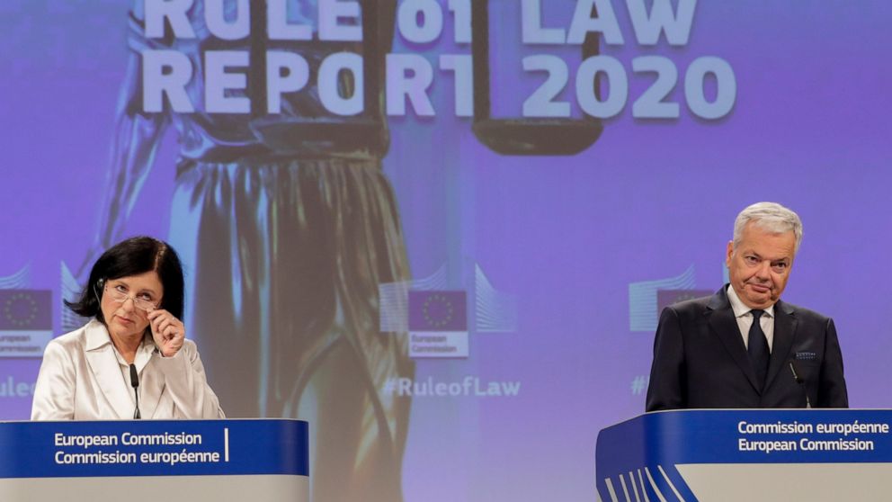 European Commissioner for Values and Transparency Vera Jourova, left, and European Commissioner for Justice Didier Reynders, participate in a media conference on the Rule of Law Report 2020 at EU headquarters in Brussels, Wednesday, Sept. 30, 2020. (