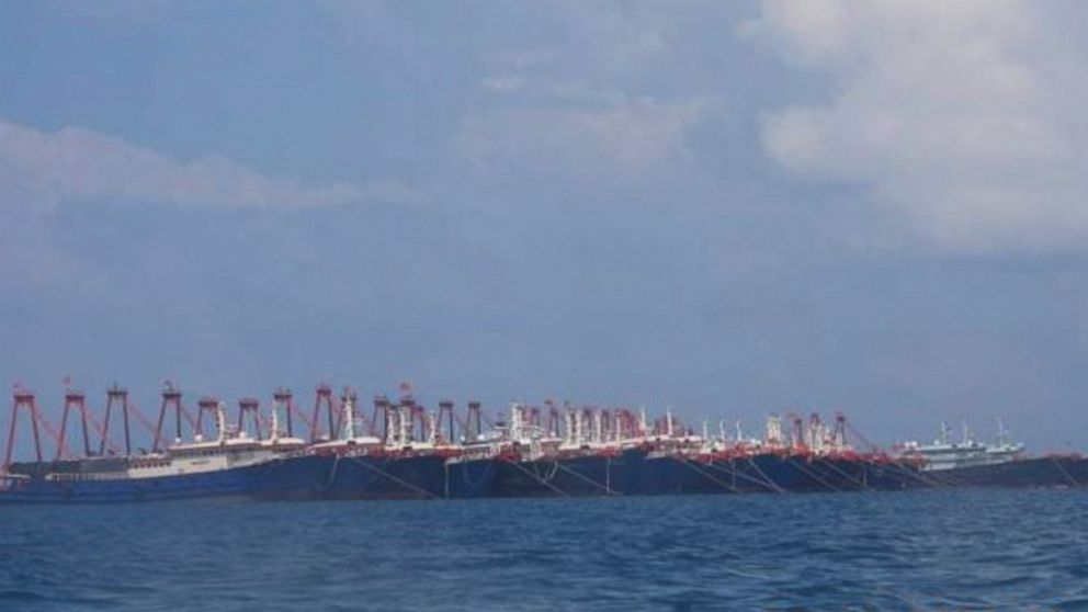 In this photo provided Sunday, March 21, 2021, by the Philippine Coast Guard/National Task Force-West Philippine Sea, some of the 220 Chinese vessels are seen moored at Whitsun Reef, South China Sea on March 7, 2021. The Philippine government express