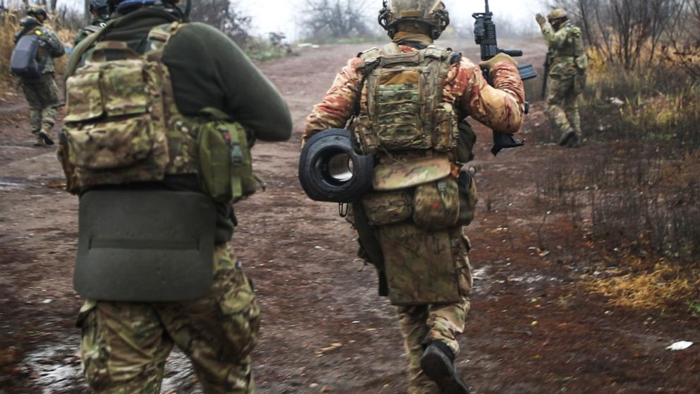 Ukrainian soldiers change their position at an undisclosed location in the Donetsk region, Ukraine, Thursday, Nov. 17, 2022. (AP Photo/Roman Chop)
