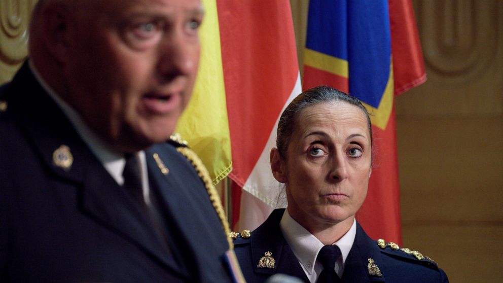 Assistant Commissioner Rhonda Blackmore, right, looks on while Regina Police Chief Evan Bray, left, speaks during a press conference at the Royal Canadian Mounted Police "F" Division headquarters in Regina, Saskatchewan, on Sunday, Sept. 4, 2022. Aut