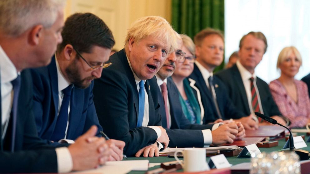 From left, Britain's Health Secretary Stephen Barclay, Cabinet Secretary and Head of the Civil Service Simon Case, Prime Minister Boris Johnson, Chancellor of the Exchequer Nadhim Zahawi, Work and Pensions Secretary Therese Coffey, Transport Secretar