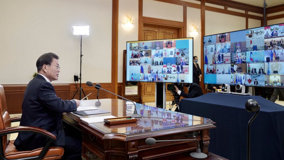 In this photo provided by South Korea Presidential Blue House via Yonhap News Agency, South Korean President Moon Jae-in attends G-20 virtual summit to discuss the coronavirus disease outbreak at the presidential Blue House in Seoul, South Korea, Thu