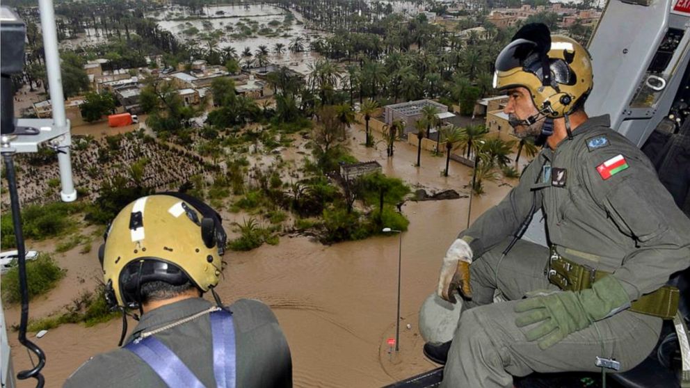 In this photo released by the Oman News Agency, Oman Air Force personnel fly over the Al Khaburah district to assess damage from Cyclone Shaheen, in Oman, Monday, Oct. 4, 2021. The death toll from Cyclone Shaheen rose to five Monday with other fisher