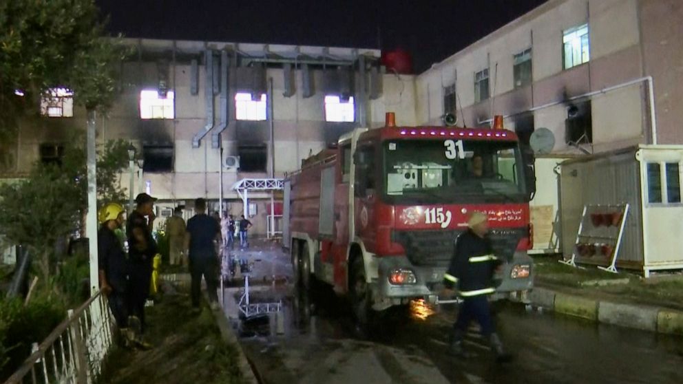 In this image made from video, first responders work the scene of a hospital fire in Baghdad on Saturday, April 24, 2021. The fire broke out in the Baghdad hospital that cares for coronavirus patients after oxygen cylinders reportedly exploded late S