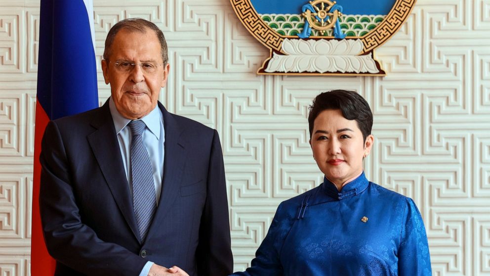 In this photo released by Russian Foreign Ministry Press Service, Mongolian Foreign Minister Batmunkh Battsetseg shakes hands with Russian Foreign Minister Sergey Lavrov prior to their talks in Ulaanbaatar, Mongolia, Tuesday, July 5, 2022. (Russian F