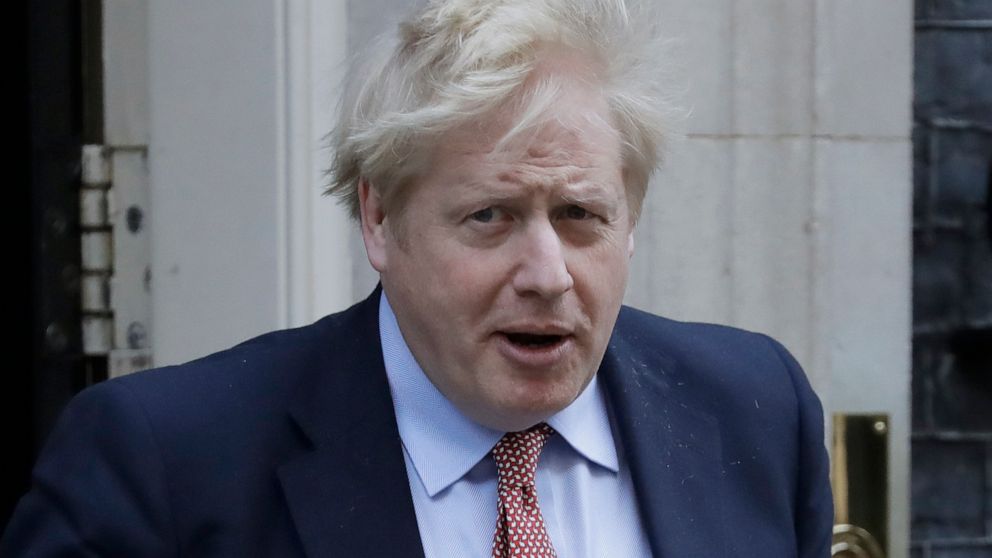 Britain's Prime Minister Boris Johnson leaves 10 Downing Street for the House of Commons for his weekly Prime Ministers Questions, in London, Wednesday, March 25, 2020. British lawmakers will vote later Wednesday to shut down Parliament for 4 weeks, 