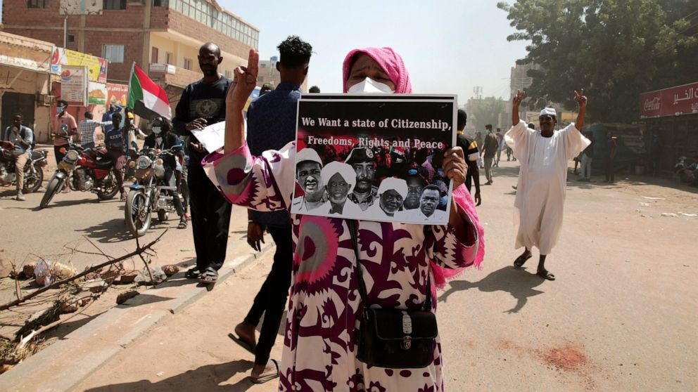 Sudanese demonstrators attend rally to demand the return to civilian rule nearly a year after a military coup led by General Abdel Fattah al-Burhan, in Khartoum, Sudan, Tuesday, Oct.25, 2022. (AP Photo/Marwan Ali)
