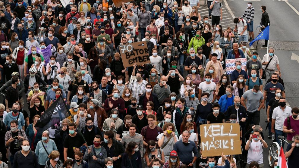 Demonstrators protesting against the dismissal of the editor-in-chief of the Hungarian news website Index.hu march in the streets of Budapest, Hungary, Friday, July 24, 2020.Dozens of journalists are resigning from Hungary's main news site because of