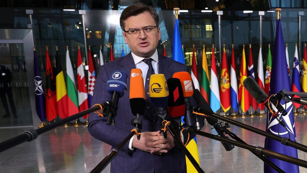 Ukraine's Foreign Minister Dmytro Kuleba speaks with the media as he arrives for a meeting of NATO foreign ministers at NATO headquarters in Brussels, Thursday, April 7, 2022. NATO foreign ministers are meeting to discuss how to bolster their support