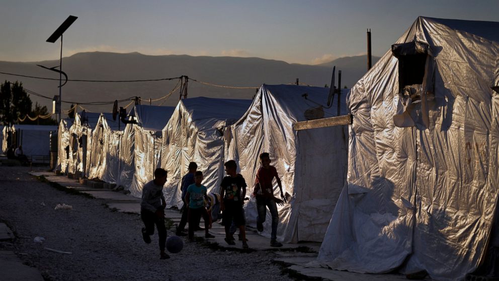 Syrian children play soccer by their tents at a refugee camp in the town of Bar Elias in the Bekaa Valley, Lebanon, July 7, 2022. The Lebanese government’s plan to start deporting Syrian refugees has sent waves of fear through vulnerable refugee comm