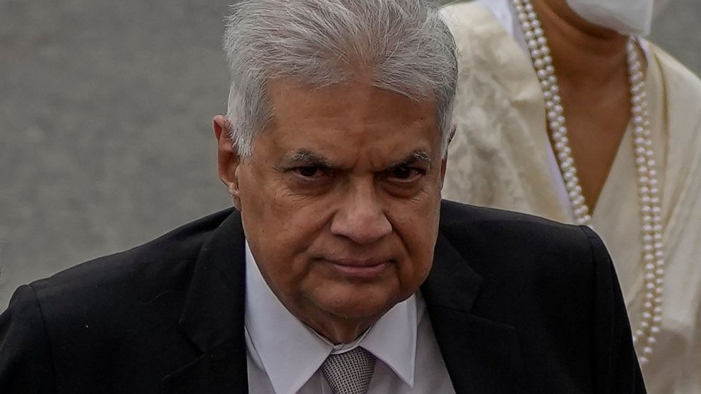 FILE - Sri Lankan president Ranil Wickremesinghe arrives at the parliamentary complex in Colombo, Sri Lanka on Aug. 3, 2022. Sri Lanka’s new government plans Tuesday, Aug. 30, 2022 to present an amended budget for the year that slashes expenses and a