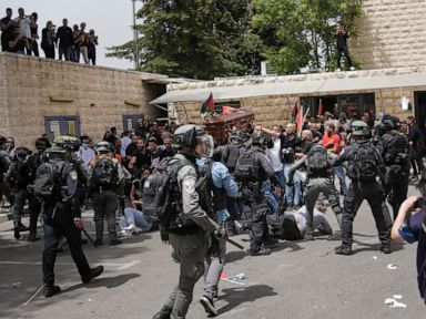 Israeli police beat pallbearers at journalist's funeral