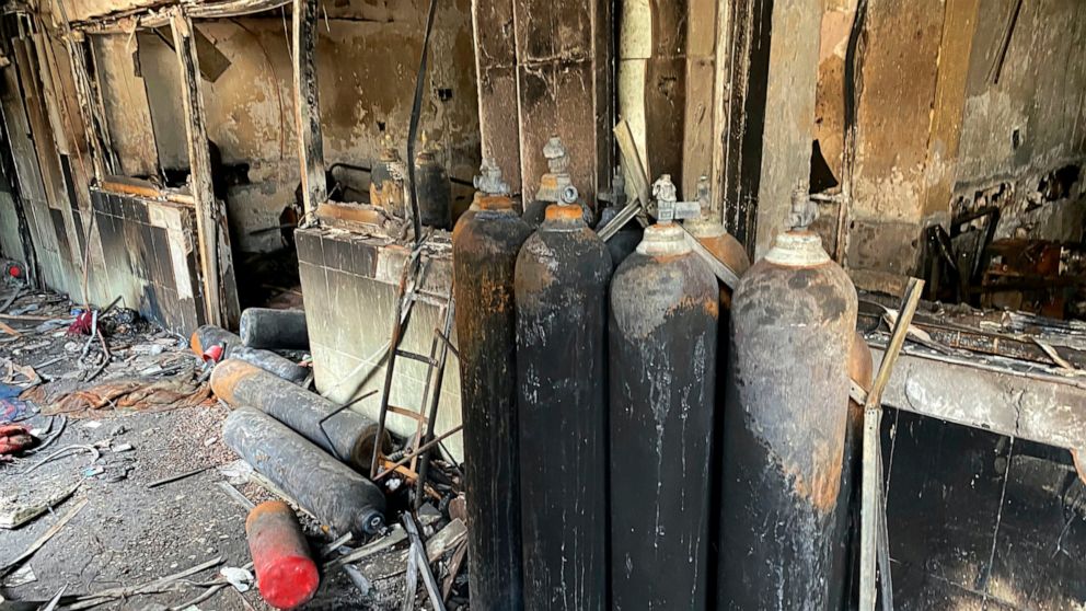 Burned oxygen cylinders are seen in the intensive care unit of the Ibn al-Khatib hospital following a fire that broke out of last Saturday evening killing over 80 people and injuring over 100, in Baghdad, Iraq, Tuesday, April 27, 2021. Medical staff 