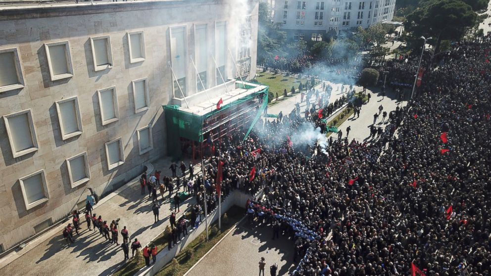 Opposition supporters take part in an anti-government rally in capital Tirana, Albania, Saturday, Feb. 16, 2019. Thousands of Albanian opposition supporters have clashed with police in an anti-government rally to protest what they says is a corrupt a