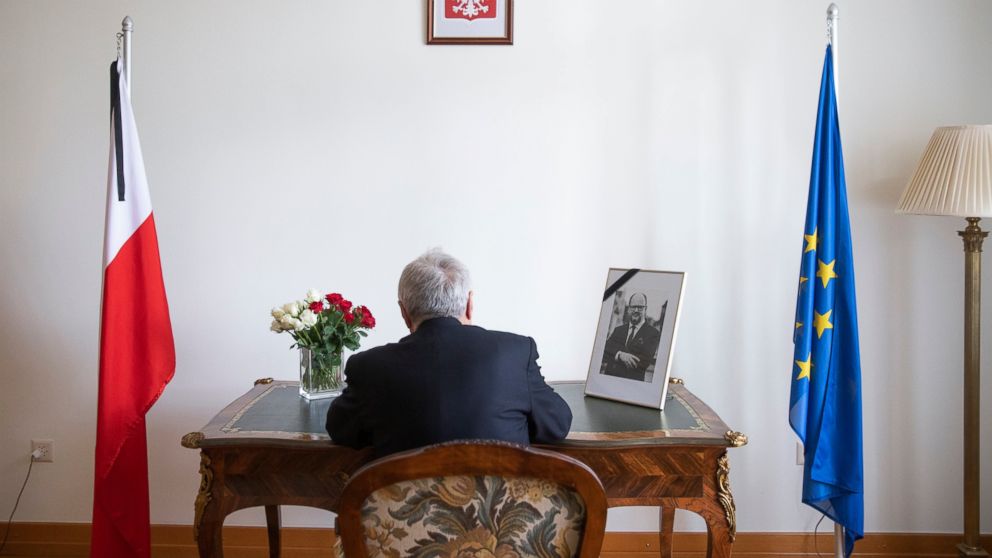 Istvan Nagy, Ambassador of Hungary to Switzerland, signs the condolence book for Pawel Adamowicz, Mayor of Gdansk, at the residence of Poland's Ambassador in Switzerland in Bern, Switzerland, Friday, Jan. 18, 2019. The Polish embassy opened a condolo