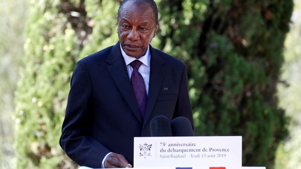 FILE - In this Thursday, Aug. 15, 2019 file photo, Guinean President Alpha Conde delivers a speech during a ceremony marking the 75th anniversary of the WWII Allied landings in Provence, in Saint-Raphael, southern France. Witnesses say heavy gunfire 
