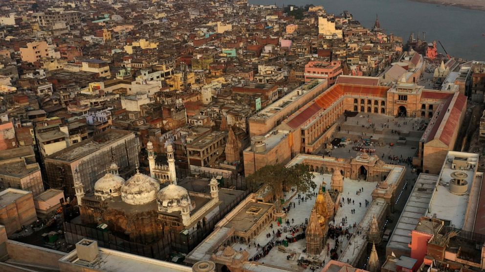 An Aerial view shows Gyanvapi mosque, left, and Kashiviswanath temple on the banks of the river Ganges in Varanasi, India, Dec. 12, 2021. A group of Hindus petitioned a local court seeking access to pray inside the mosque compound, saying they believ