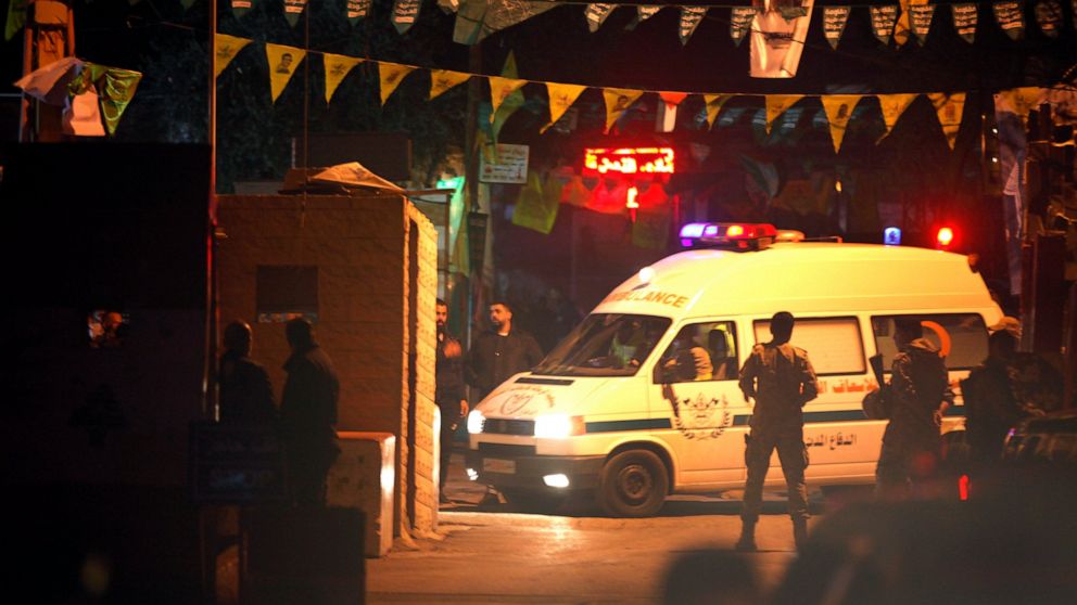 An ambulance enters the Burj Shamali Palestinian refugee camp, in the southern port city of Tyre, Lebanon, Friday, Dec. 10, 2021. Arms stored for the Palestinian Hamas group exploded in a refugee camp in southern Lebanon on Friday night, killing and 