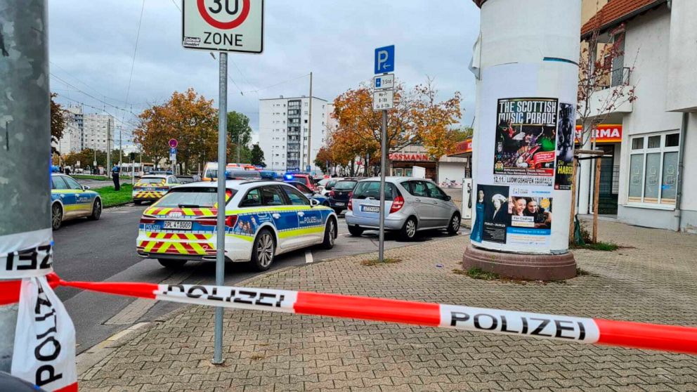 A street has been cordoned off in the Oggersheim district of the city of Ludwigshafen, Germany, Tuesday, Oct. 18, 2022. Two people were killed and another seriously hurt in a stabbing in southwestern Germany on Tuesday, police said. The suspected ass