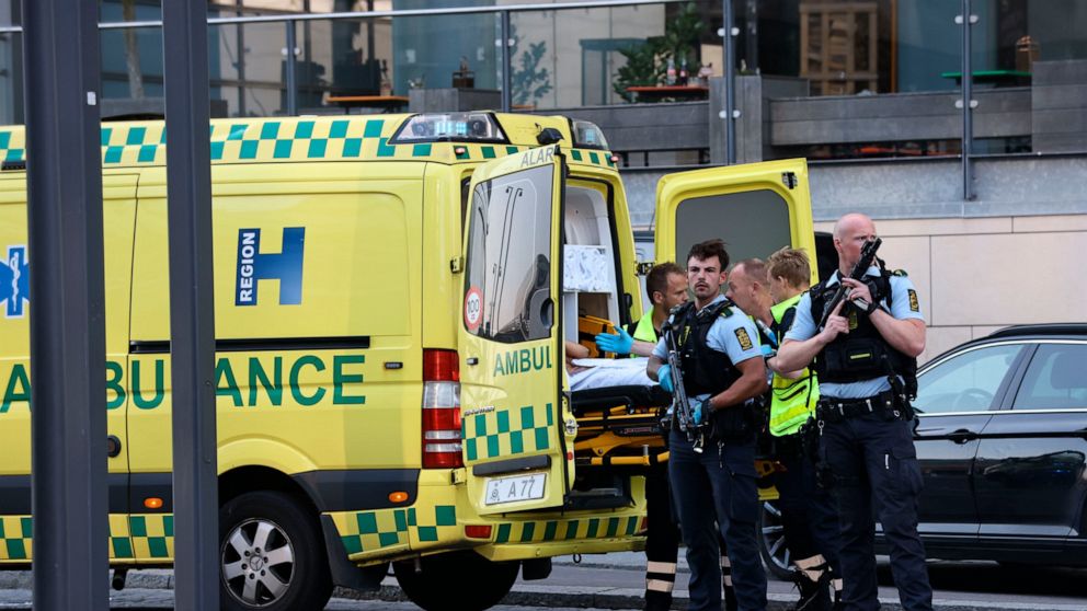 An ambulance and armed police outside the Field's shopping center, in Orestad, Copenhagen, Denmark, Sunday, July 3, 2022, after reports of shots fired. (Olafur Steinar Gestsson /Ritzau Scanpix via AP)