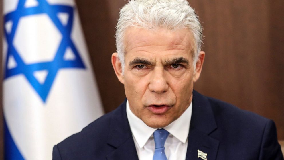 FILE - Israel's caretaker Prime Minister Yair Lapid heads a cabinet meeting in Jerusalem on July 31, 2022. Lapid took a gamble with his pre-emptive strike against Islamic Jihad militants in Gaza, less than three months before he competes in general e