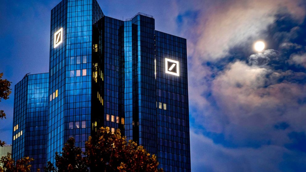 FILE — File Photo shows the moon shining next to the headquarters of the Deutsche Bank in Frankfurt, Germany, Oct.4, 2020. (AP Photo/Michael Probst, File)