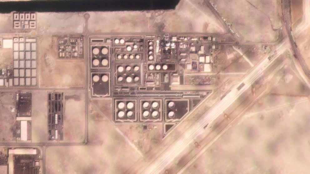 In this satellite image provided by Planet Labs PBC, white fire suppressing foam is seen after an attack on an Abu Dhabi National Oil Co. fuel depot in the Mussafah neighborhood of Abu Dhabi, United Arab Emirates, Monday, Jan. 17, 2022. A drone attac