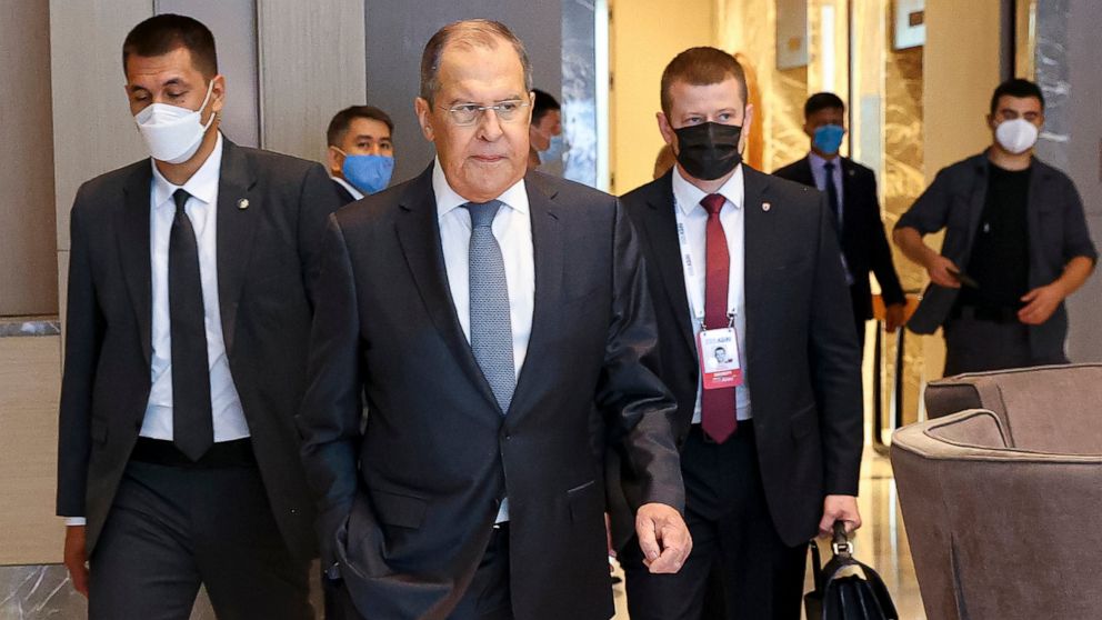 In this photo released by Russian Foreign Ministry Press Service, Russian Foreign Minister Sergey Lavrov, center, arrives to attend a Central and South Asia 2021 conference in Tashkent, Uzbekistan, Friday, July 16, 2021. (Russian Foreign Ministry Pre
