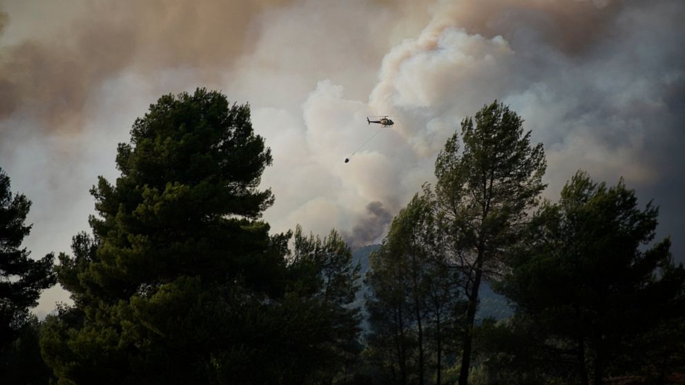 Wildfire burns in northeast Spain; summer camp evacuated