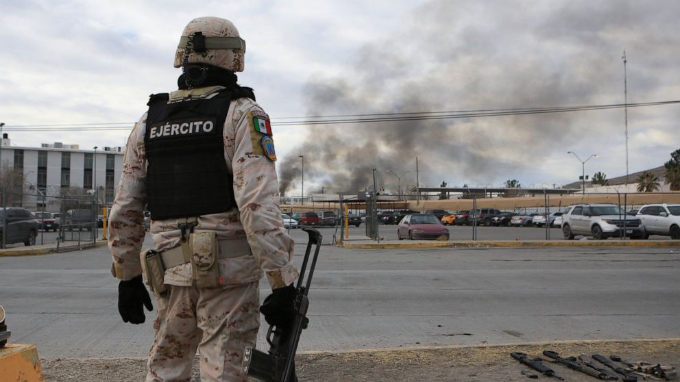 A Mexican soldiers stands guard outside a state prison in Ciudad Juarez, Mexico, Sunday Jan 1, 2023. Mexican soldiers and state police regained control of a state prison in Ciudad Juarez across the border from El Paso, Texas after violence broke out 