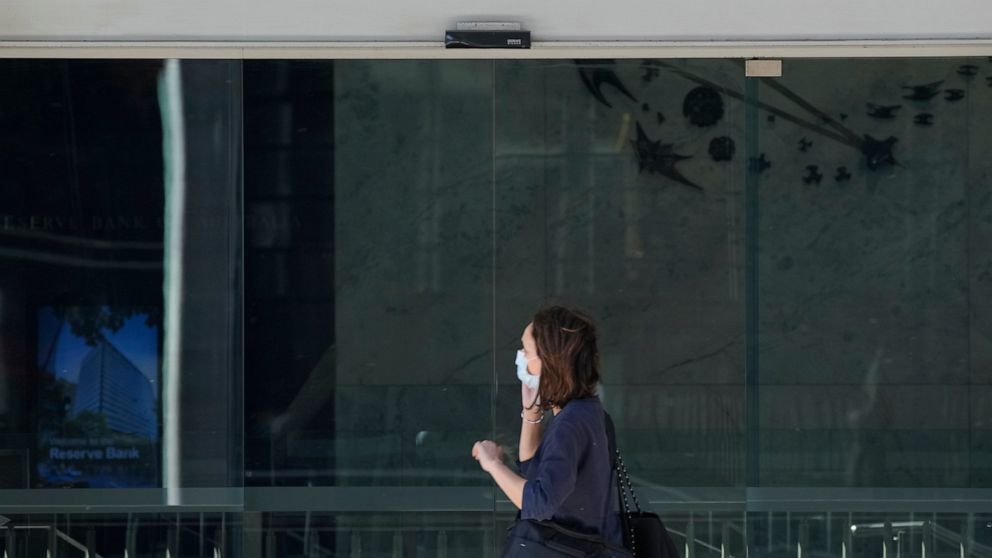 A woman walks past the Reserve Bank of Australia in Sydney, Tuesday, Nov. 1, 2022. Australia’s central bank boosted its benchmark interest rate for a seventh consecutive month to a nine-year high of 2.85 percent. (AP Photo/Rick Rycroft)