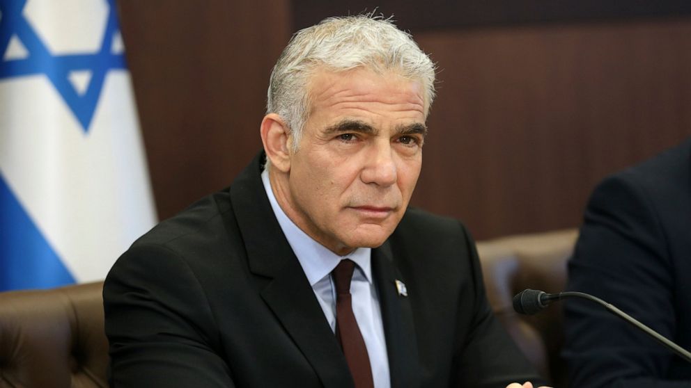 Israel's caretaker Prime Minister Yair Lapid chairs the first cabinet meeting in Jerusalem Sunday, July 3, 2022, days after lawmakers dissolved parliament. (Gil Cohen-Magen/Pool Photo via AP)