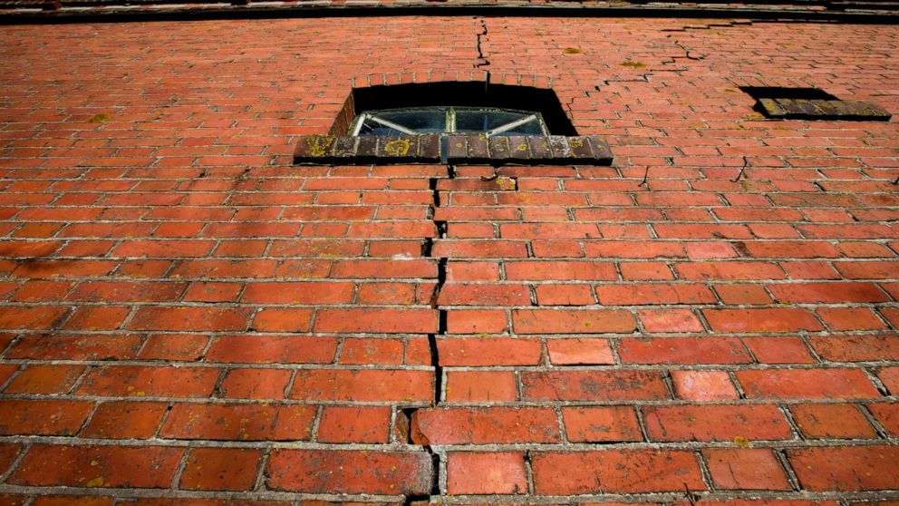 FILE - A crack is seen in the wall of a farm after a series of small tremors caused by decades of gas extraction, in Hunzinge, in Groningen province, northern Netherlands, Friday, Jan. 19, 2018. The Dutch government has sparked anger in the northern 