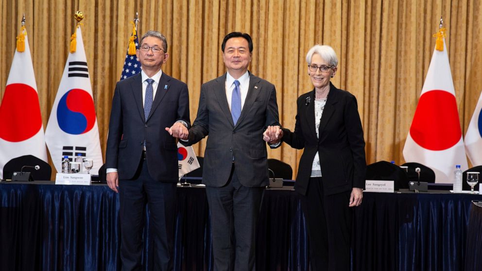 Japanese Vice Mminister for Foreign Affairs Takeo Mori, South Korea's First Vice Foreign Minister Cho Hyun-dong and U.S. Deputy Secretary of State Wendy Sherman pose for a photo prior to their meeting at the Foreign Ministry in Seoul, South Korea, Ju