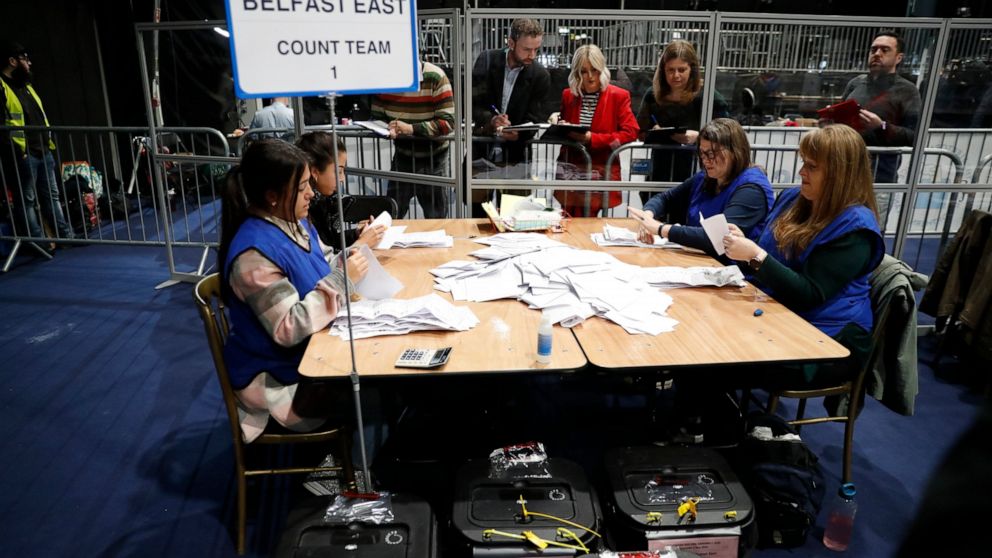 Election staff begin vote counting in Belfast in the Northern Ireland Assembly election early Friday in Belfast, Northern Ireland, Friday, May 6, 2022. In Northern Ireland, voters are electing a new 90-seat Assembly, with polls suggesting the Irish n