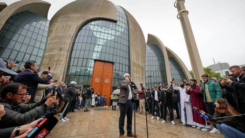 Muezzin Mustafa Kader recites the call to prayer at the Cologne Central Mosque in Cologne, Germany, Friday, Oct. 14, 2022. The Islamic call to prayer is set to sound for the first time from one of Germany’s biggest mosques in Cologne on Friday — but 