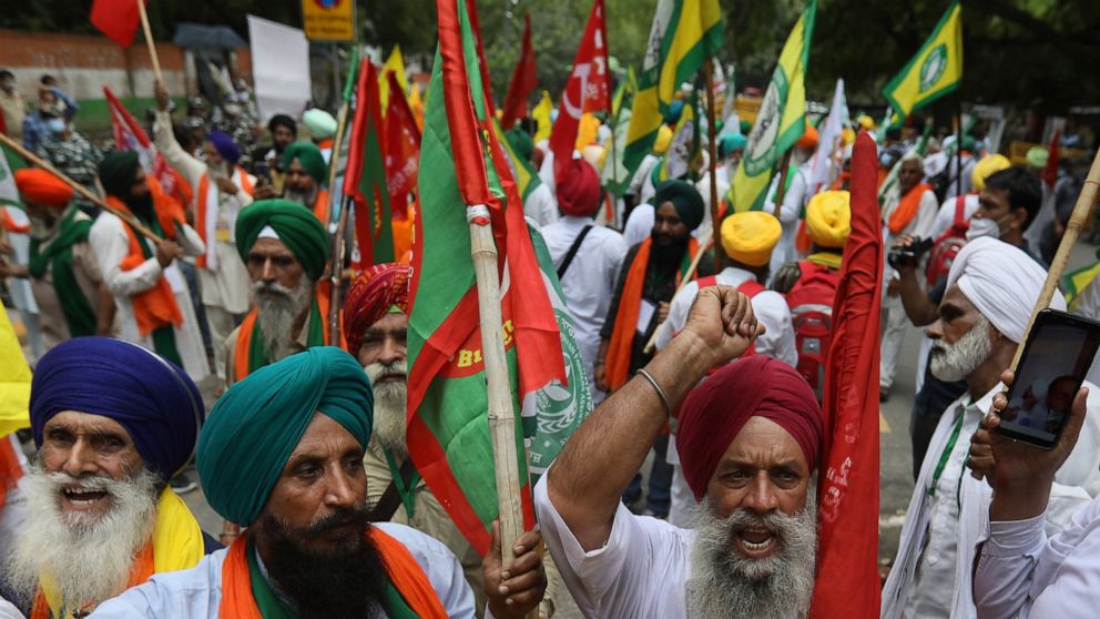 Farmers shout anti government slogans during a protest in New Delhi, India, Thursday, July 22, 2021. More than 200 farmers on Thursday began a protest near India's Parliament to mark eight months of their agitation against new agricultural laws that 