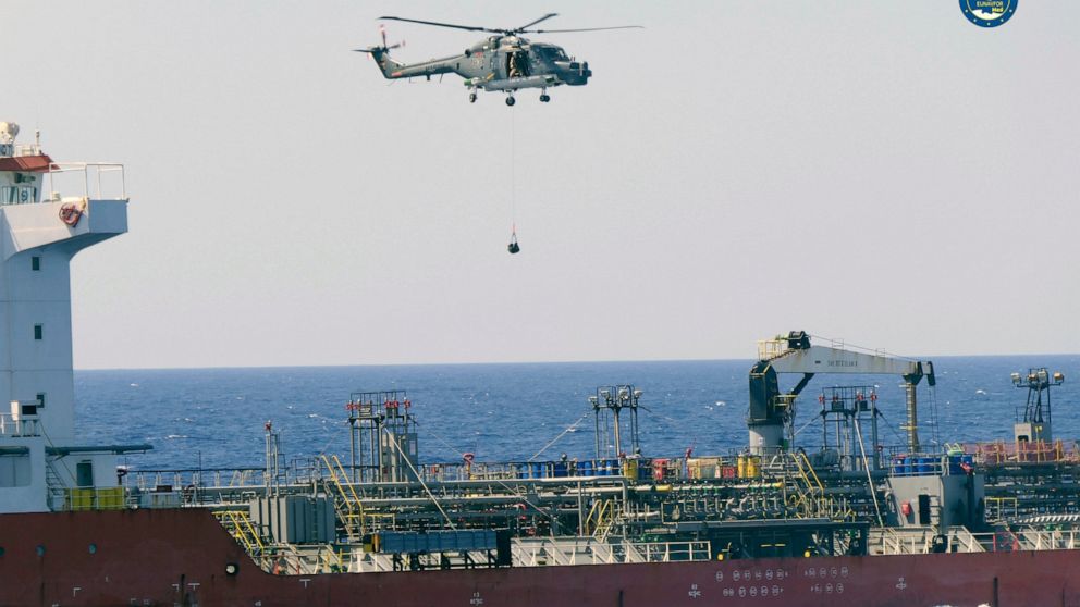 A boarding team board the Merchant Vessel Royal Diamond 7, in international waters, 150 kilometers north of the Libyan city of Derna, Thursday, Sept. 10, 2020. The European Union maritime force enforcing the U.N. arms embargo on Libya said Thursday i