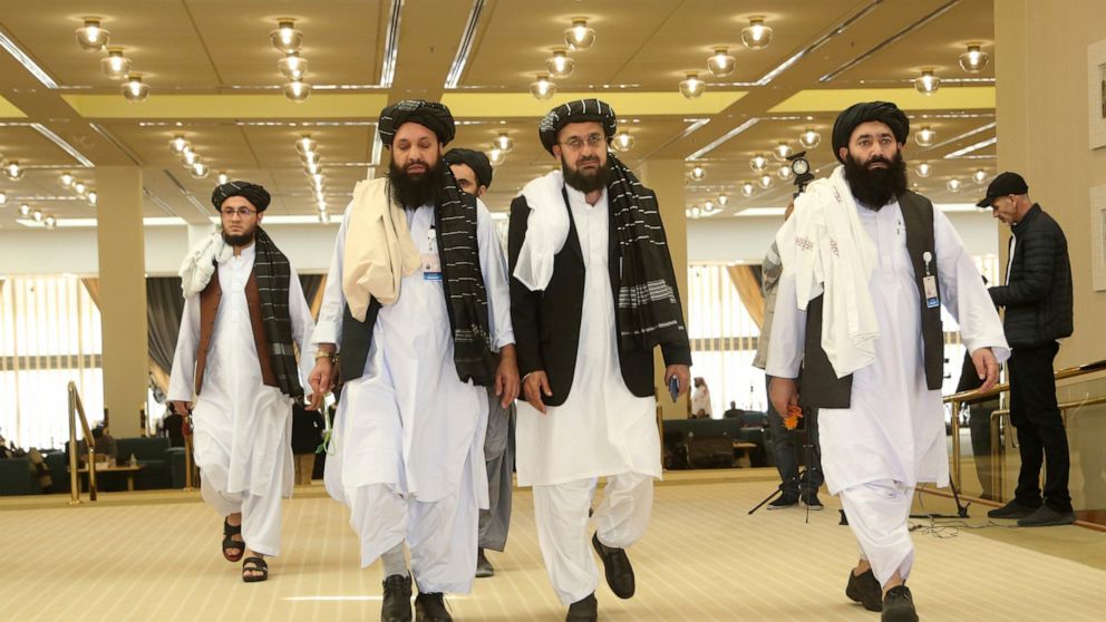 FILE- In this Feb. 29, 2020, file, photo, Afghanistan's Taliban delegation arrive for the agreement signing between Taliban and U.S. officials in Doha, Qatar. Taliban officials said Friday, July 17, 2020 that the son of the movement’s feared founder 