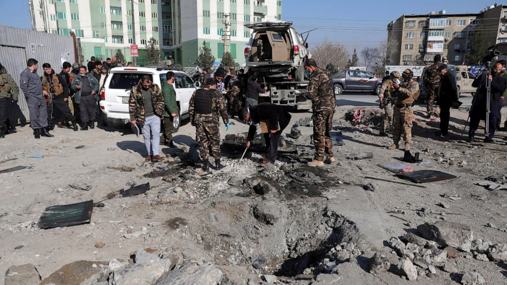 Afghan police arrive at the site of a bomb attack in Kabul, Afghanistan, Tuesday, Dec. 15, 2020. A bombing and a shooting attack on Tuesday in the Afghan capital of Kabul killed a few people, including a deputy provincial governor, officials said.(AP