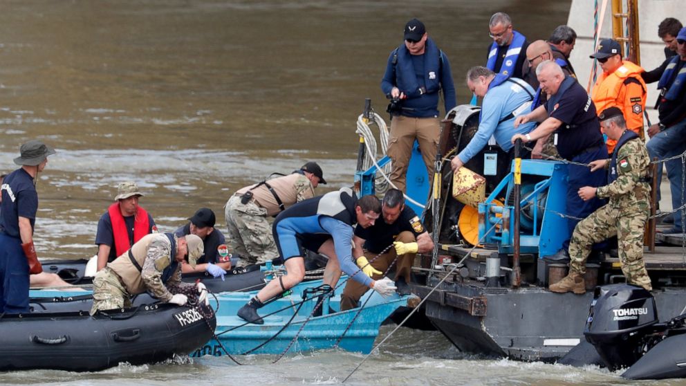 A rescue crew works on the Danube river where a sightseeing boat capsized in Budapest, Hungary, Tuesday, June 4, 2019. Divers recovered the bodies Monday of two more victims who were on a tour boat that capsized and sank in the Danube River after a c