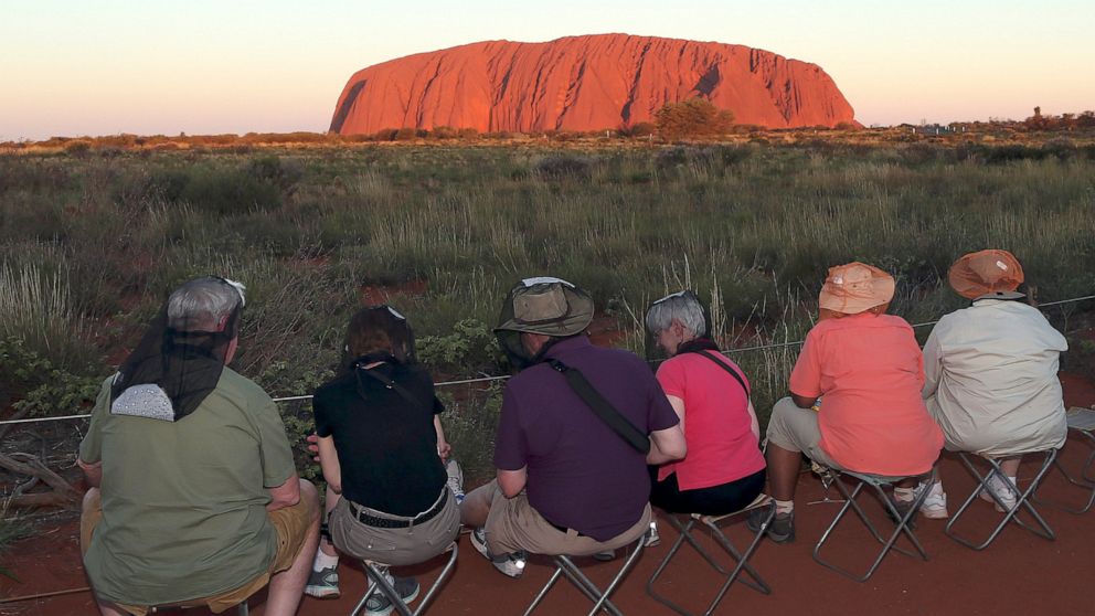 Climbers rush to beat ban on Australia's iconic rock Uluru thumbnail