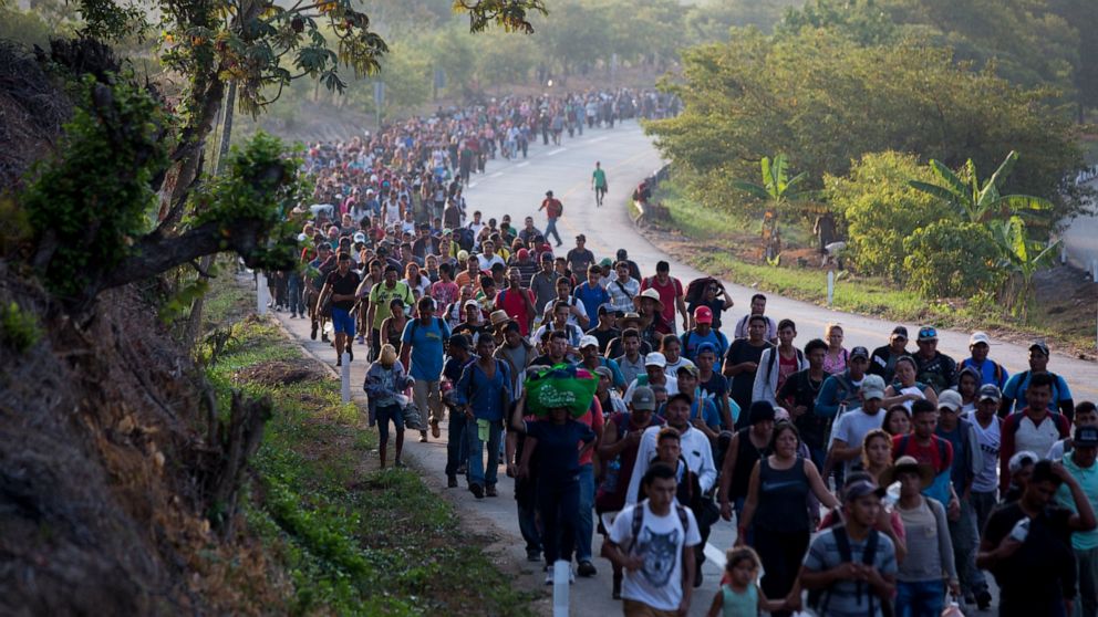 (The Associated Press) Central American migrants, part of a caravan hoping to reach the U.S. border, move on the road in Escuintla, Chiapas State, Mexico, Saturday, April 20, 2019. Thousands of migrants in several different caravans have been gathering in Chiapas in recent days and weeks. (AP Photo/Moises Castillo)