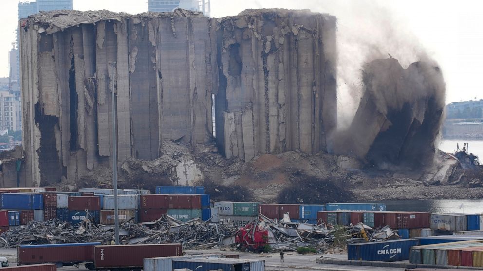 A left part of the silos damaged during the August 2020 massive explosion in the port is seen collapsing, in Beirut, Lebanon,in Beirut, Lebanon, Thursday, Aug. 4, 2022. (AP Photo/Hussein Malla)