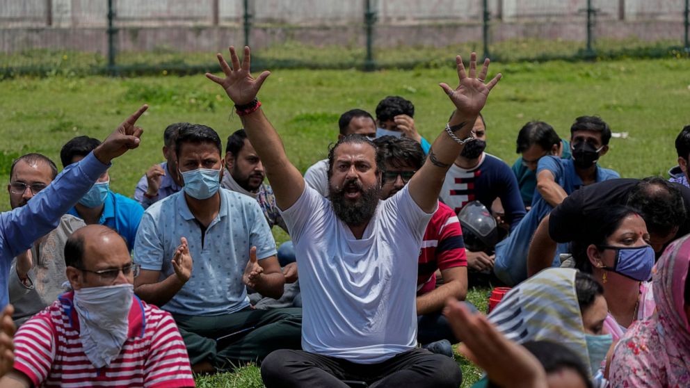 FILE- Kashmiri Hindus protest against the killing of a Hindu female teacher by suspected rebels in Srinagar, Indian controlled Kashmir, Tuesday, May 31, 2022. Assailants fatally shot another Kashmiri Hindu, who are locally known as Pandits, in Indian