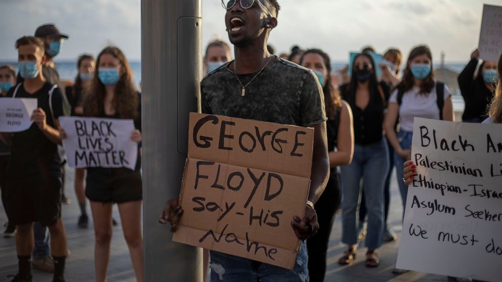 Protesters shout slogans during a protest to decry the killing of George Floyd in front of the American embassy in Tel Aviv, Israel, Tuesday, June 2, 2020. (AP Photo/Ariel Schalit)