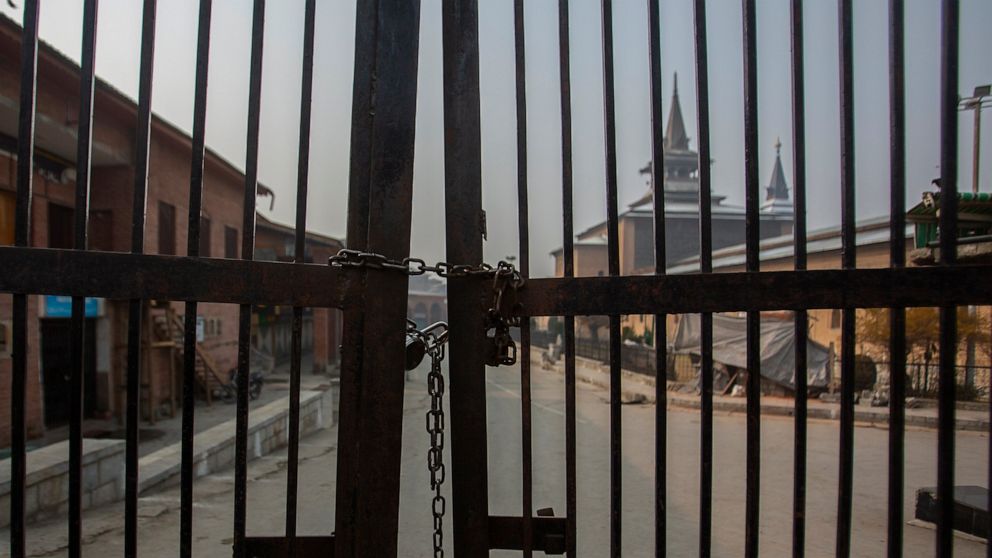 Kashmir's Jamia Masjid, or the grand mosque is seen through its gate that remains locked on Fridays in Srinagar, Indian controlled Kashmir, Nov. 26, 2021. Authorities allow the mosque to remain open the other six days, but only a few hundred worshipp