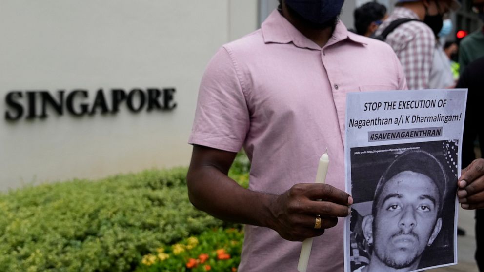 FILE - Activists attend a candlelight vigil against the impending execution of Nagaenthran K. Dharmalingam, sentenced to death for trafficking heroin into Singapore, outside the Singaporean embassy in Kuala Lumpur, Malaysia, on Nov. 8, 2021. The Mala