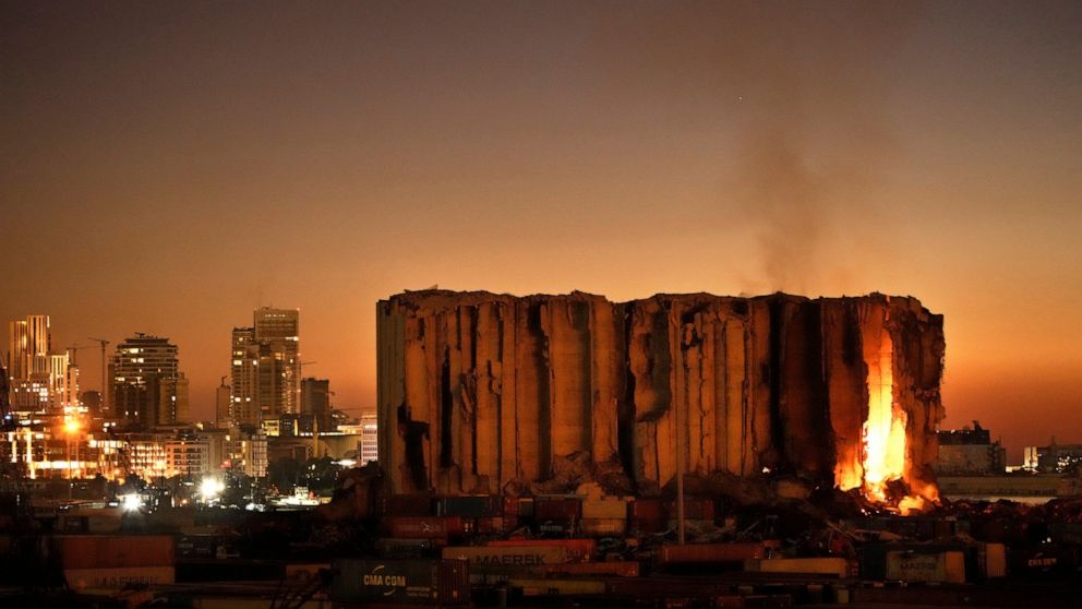 FILE - Silos in the north block of the Beirut Port, that were destroyed by a massive explosion in 2020, have caught fire due to fermented grains in Beirut, Lebanon, Sunday, July 24, 2022. It has been two years since a warehouse full of ammonium nitra